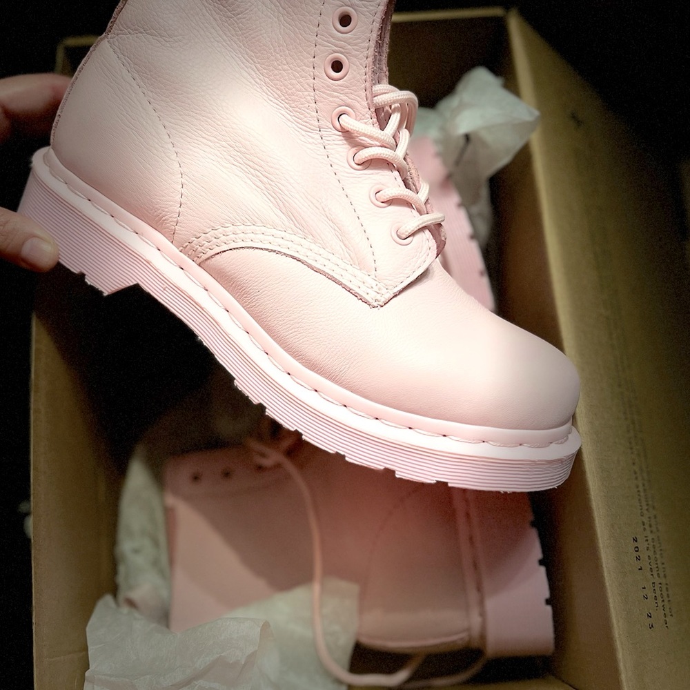 Dr. Marten chalk pink lace up boots.